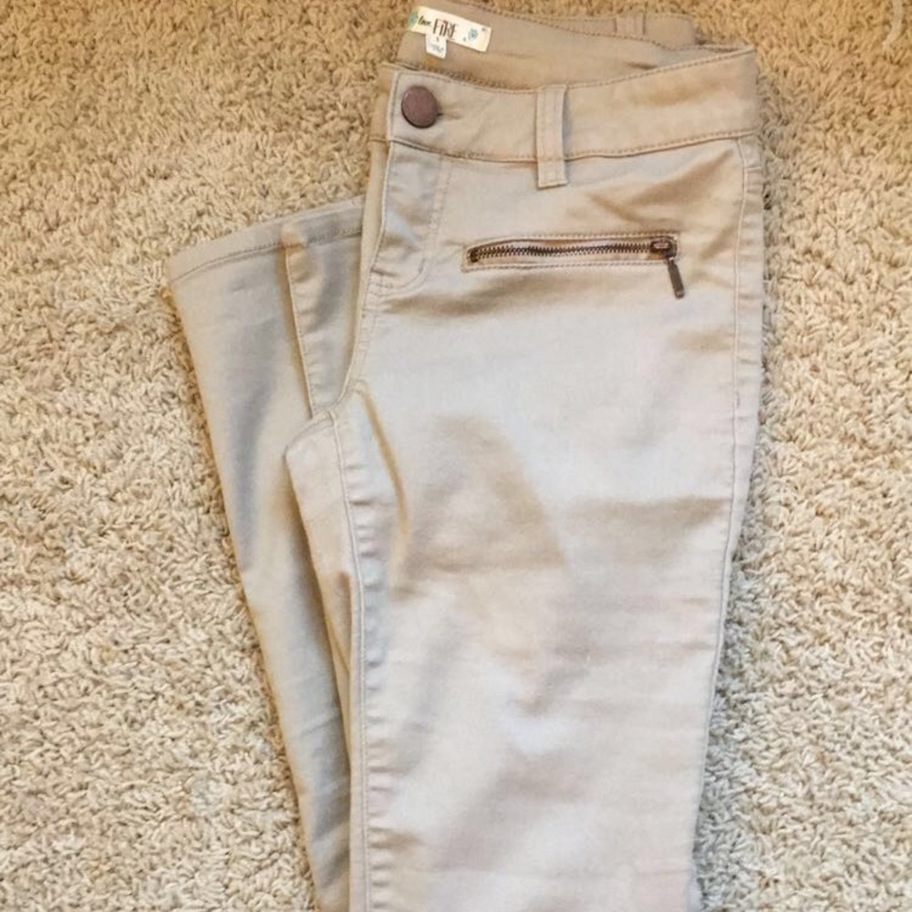 Khaki pants with bronze zippers and detailing